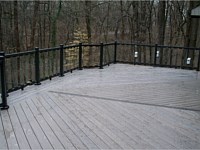 <b>TimberTech Legacy Ashwood Decking installed in Diagonal Pattern with Espresso Feature Board and Black Aluminum Railing with Glass Pickets</b>